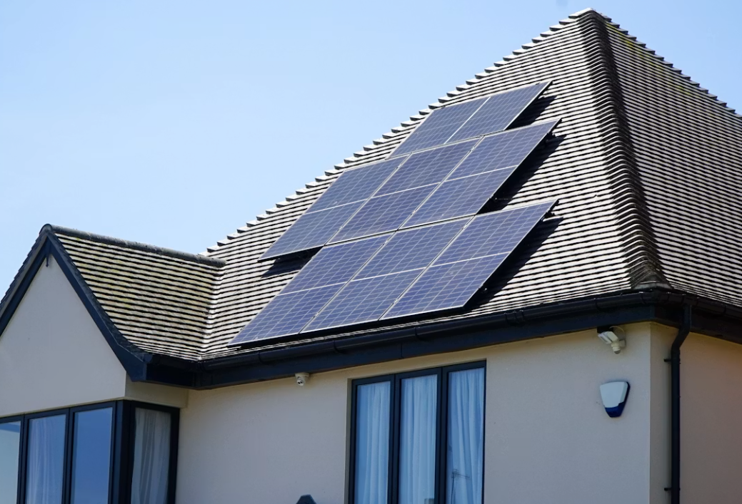 Panels stepped around the hips of a tile roof.