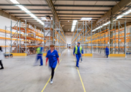 A commercial warehouse with workers.